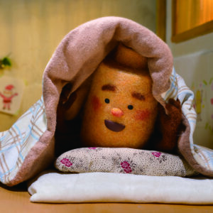 A battery hiding in bed under the covers from other batteries.