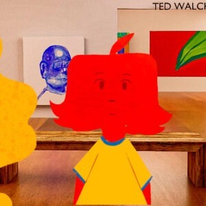 A girl with red hair in an art gallery.