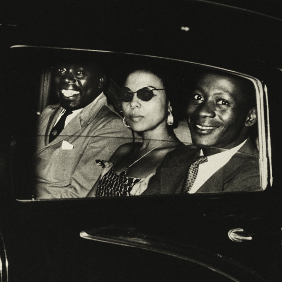 Three people in a car.