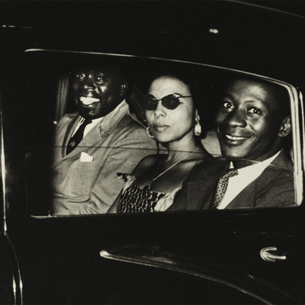 Three people in a car.