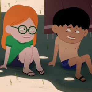 Two children sitting next to each other on the grass.